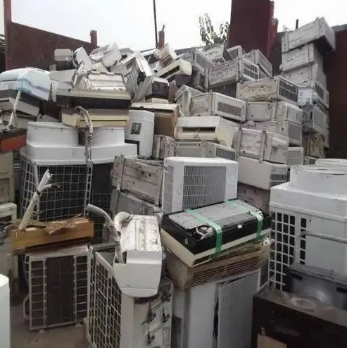 Air conditioner units stacked in a yard